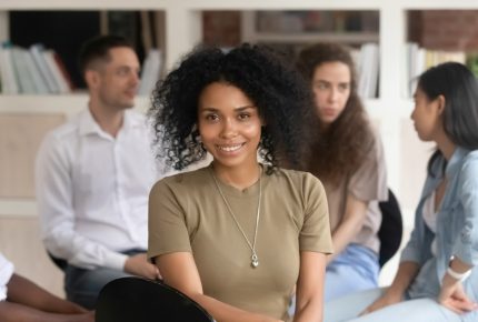 African,American,Female,Psychologist,Psychotherapist,Looking,At,Camera,During,Group