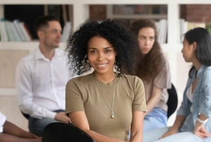 African,American,Female,Psychologist,Psychotherapist,Looking,At,Camera,During,Group